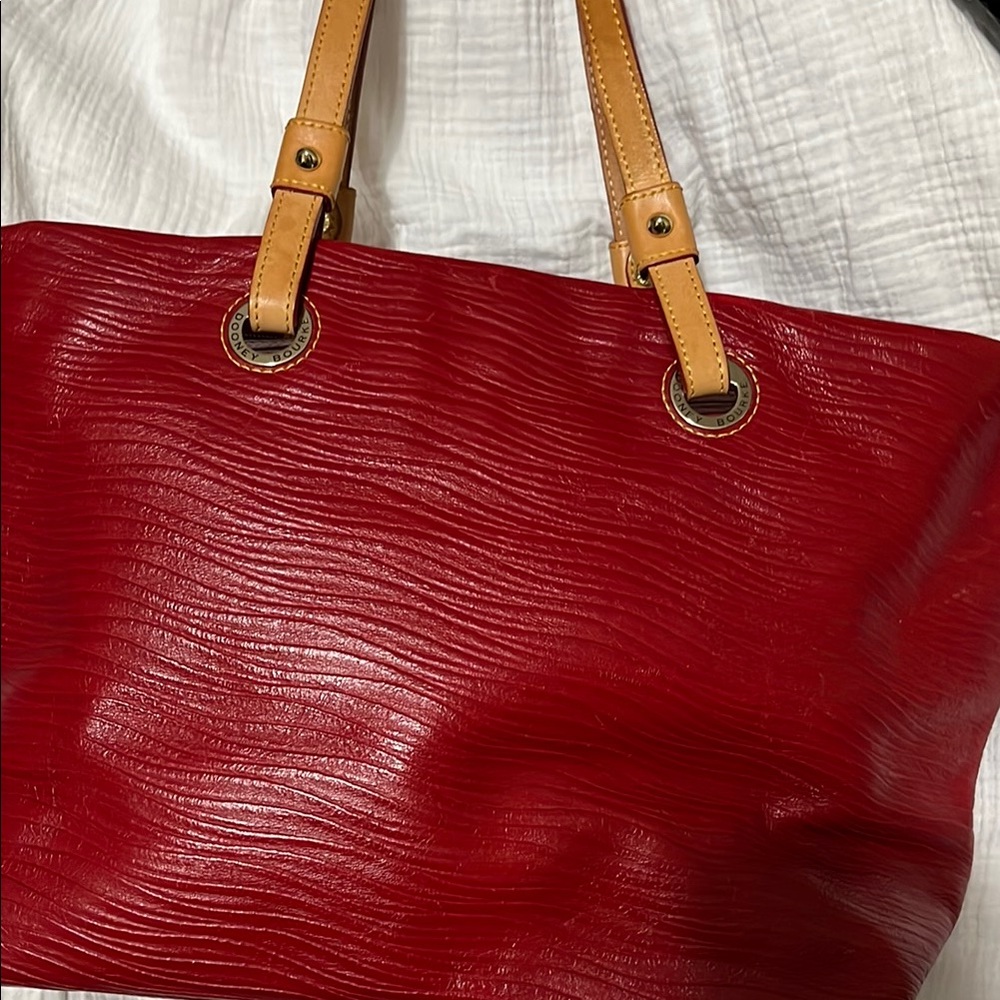 Vibrant Red Leather Tote with Textured Surface and Tan Handles